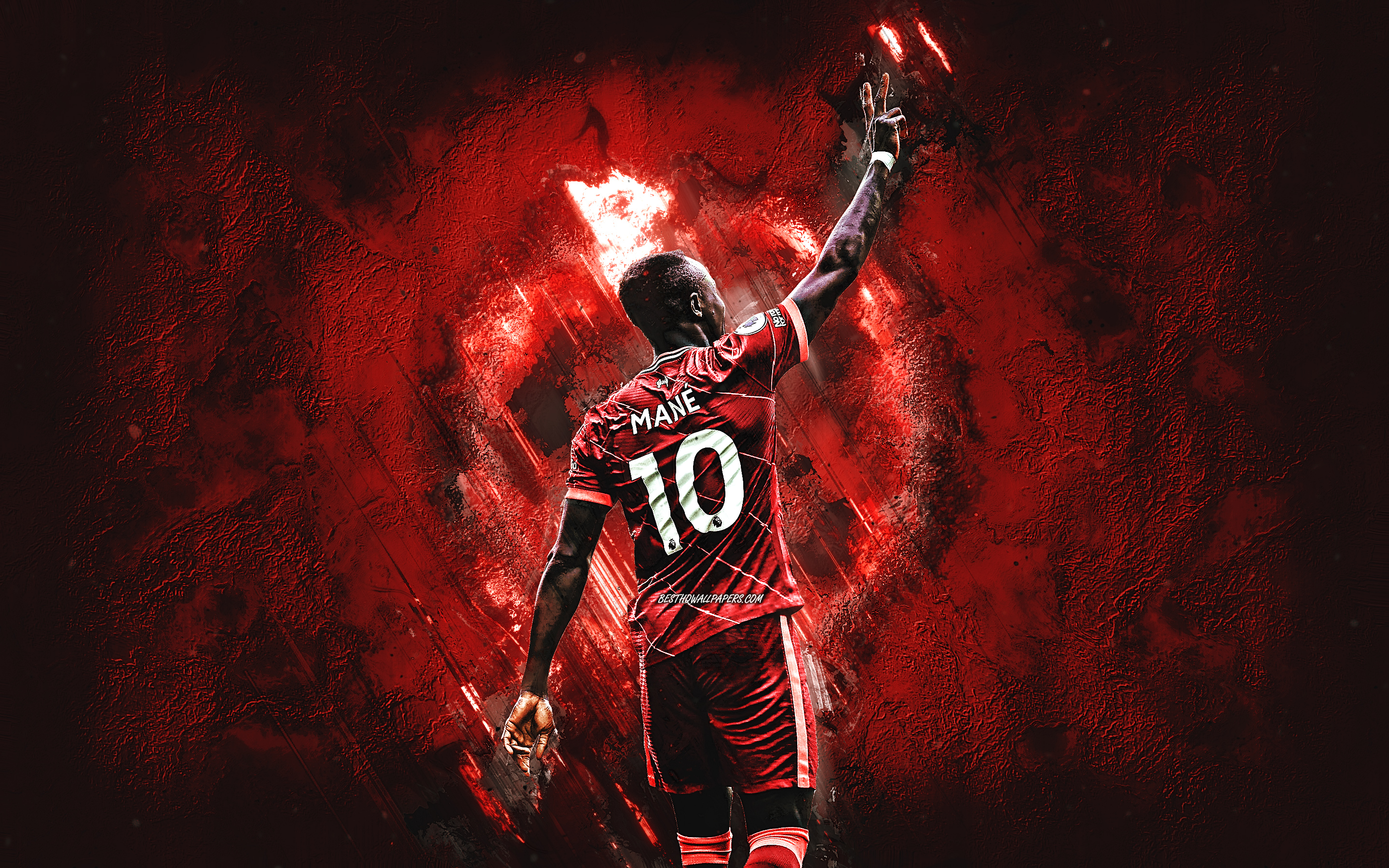 https://ts10.tarafdari.com/contents/user8830/content-image/sadio-mane-liverpool-fc-senegalese-footballer-midfielder-red-stone-background.jpg